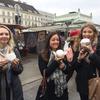Students eating Krapfen at Naschmarkt February 2017